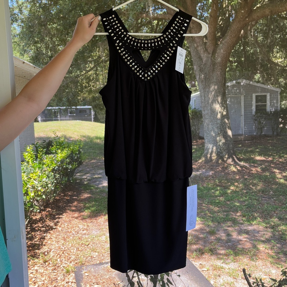 Cache black mini dress. Brand new w/tags. This dress hugs all the right places!!